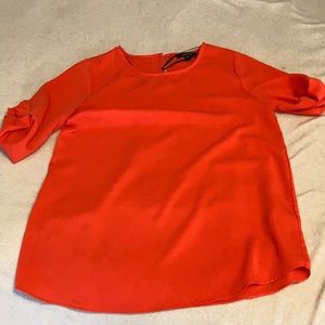 Neon orange blouse